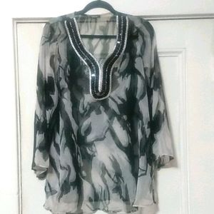 Blouse with adornments